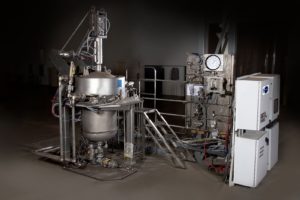 Side view of caustic autoclave system