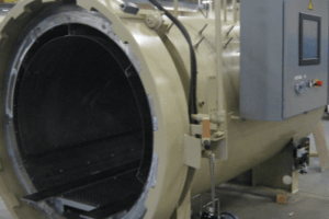 Side view of open composite autoclave system
